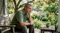 Man sitting at kitchen table experiencing smoking craving
