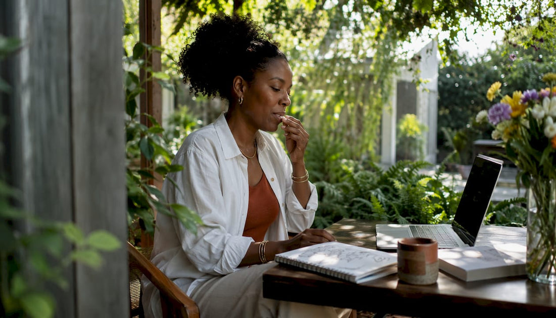 Woman handling smoking urge at office desk