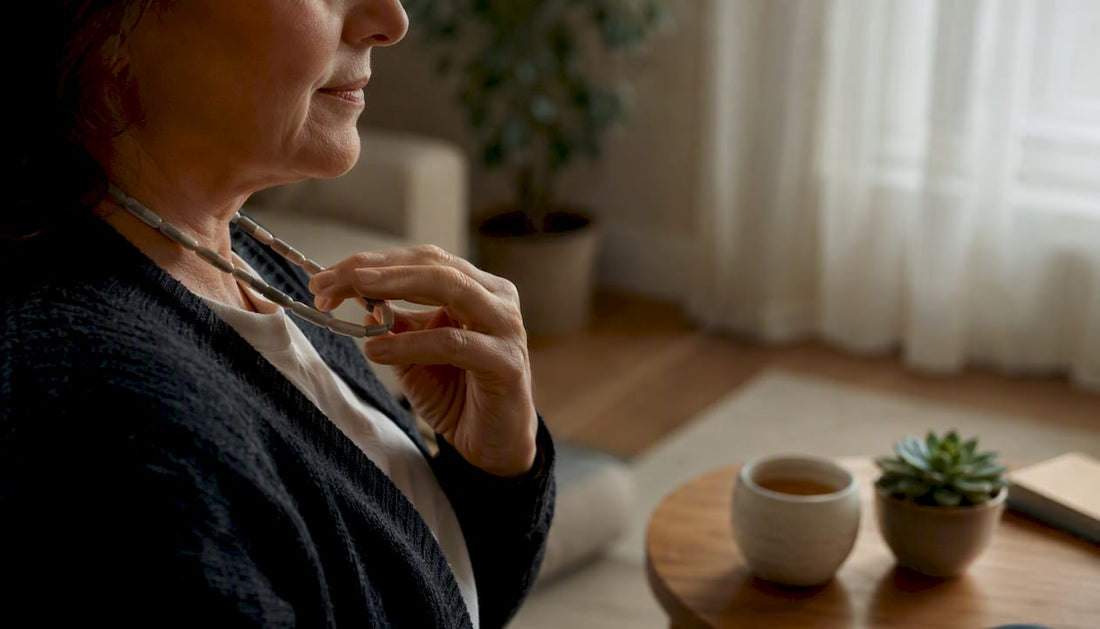 Hands holding resistance necklace in calm setting