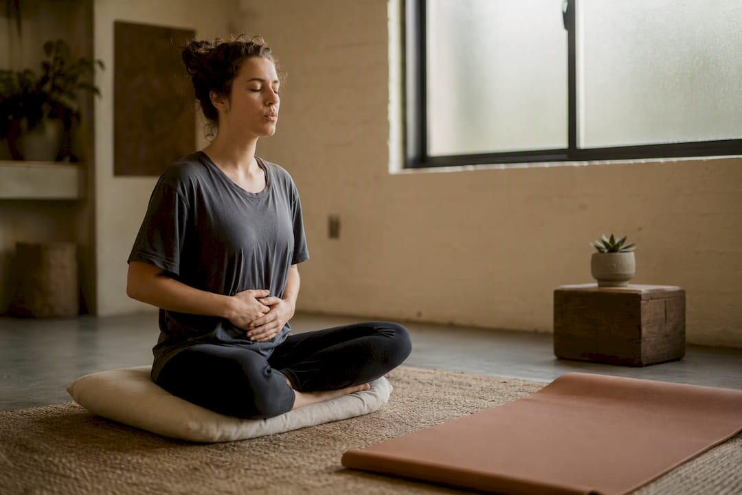 Person doing breathwork indoors