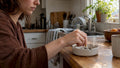 Hand extinguishing a cigarette in an ashtray